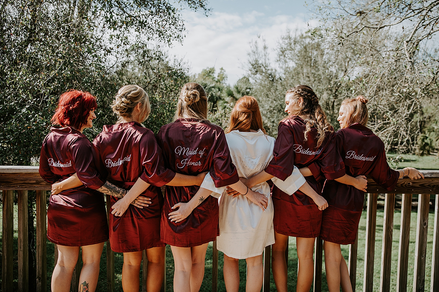 Bride and Bridesmaids with cute title robes BMR Stables Wedding Photography captured by South Florida Wedding Photographer Maggie Alvarez Photography