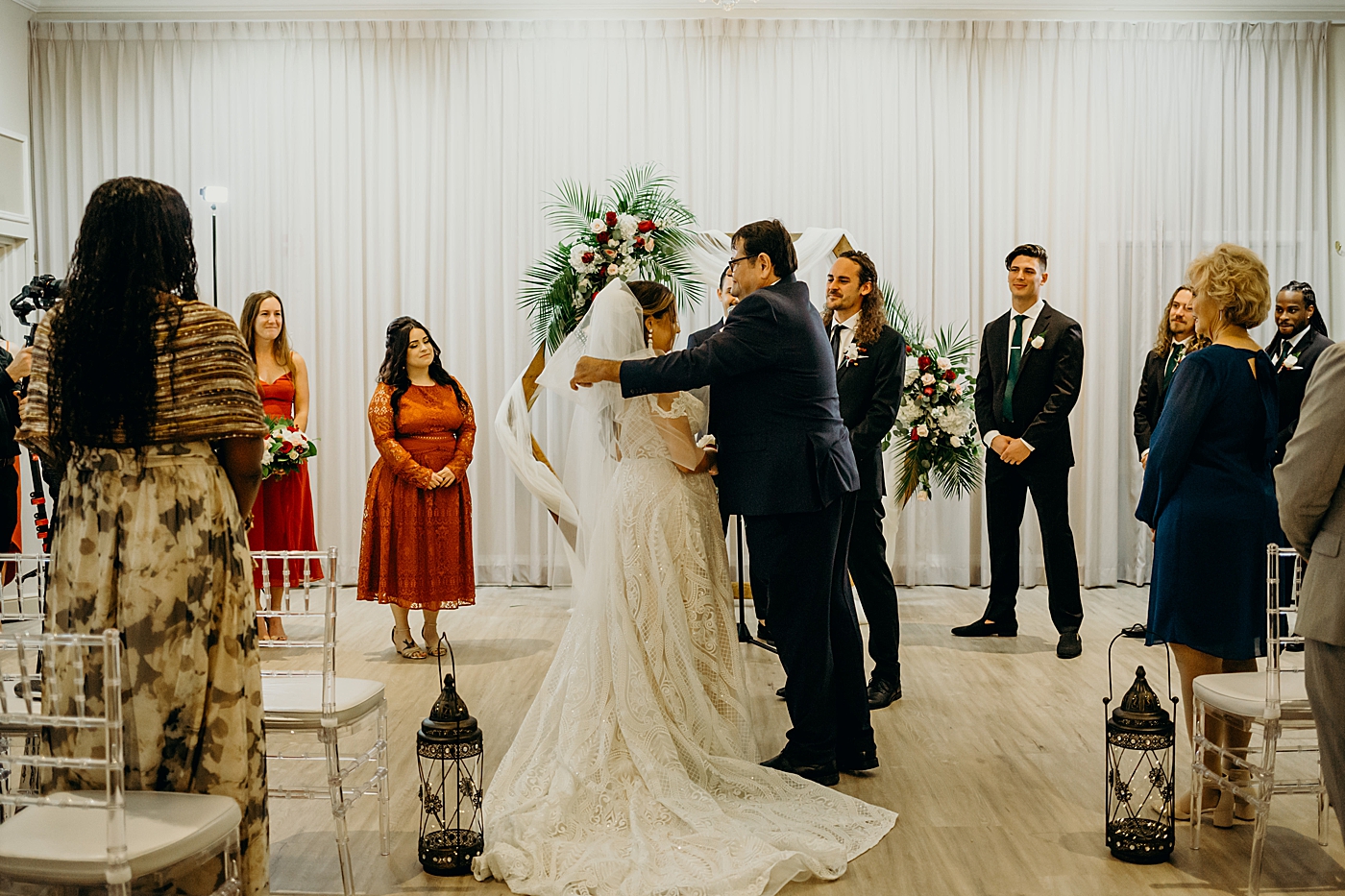 Father removing veil off Bride's face Benvenuto Restaurant Wedding Photography captured by South Florida Wedding Photographer Maggie Alvarez Photography