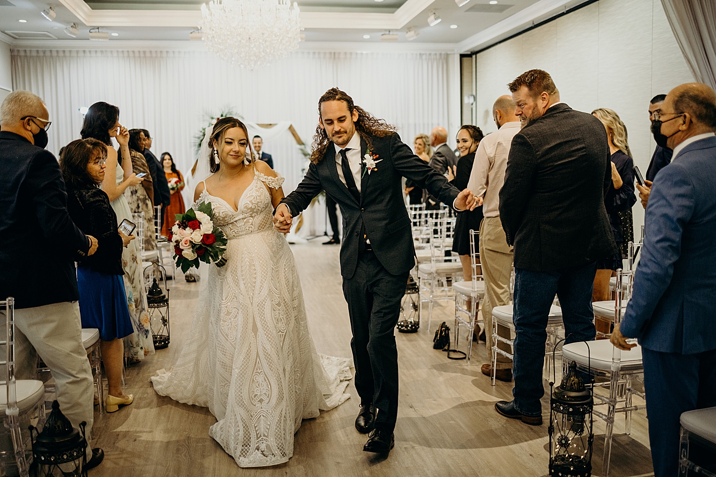 Bride and Groom having a fun exit Benvenuto Restaurant Wedding Photography captured by South Florida Wedding Photographer Maggie Alvarez Photography