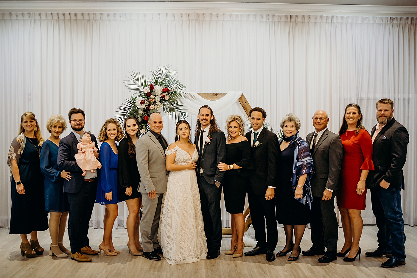 Bride and Groom with family portrait Benvenuto Restaurant Wedding Photography captured by South Florida Wedding Photographer Maggie Alvarez Photography
