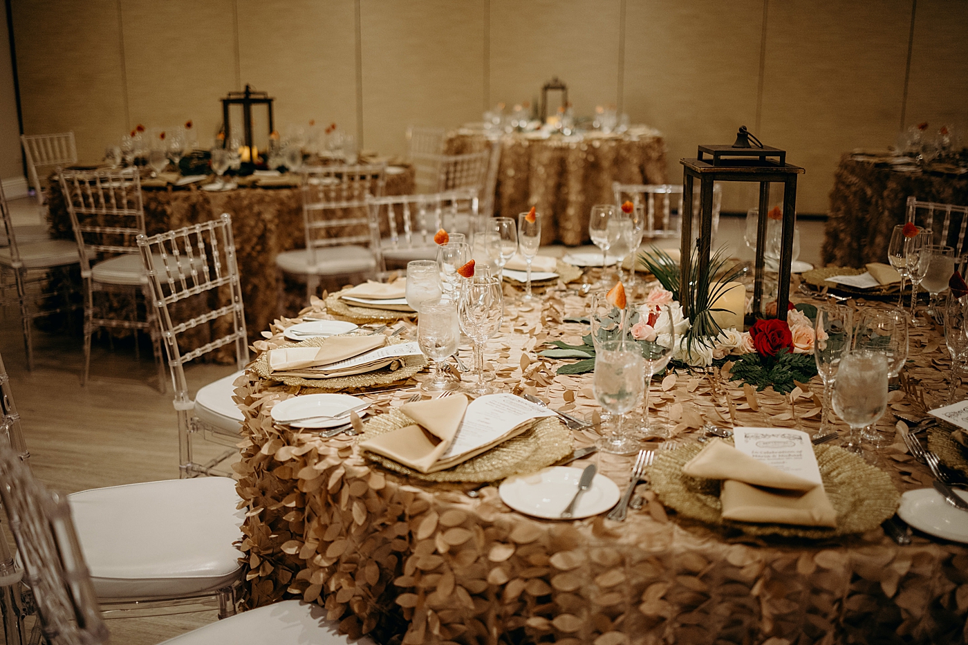 Reception detail shot of tables covered with pale leaf table clothes Benvenuto Restaurant Wedding Photography captured by South Florida Wedding Photographer Maggie Alvarez Photography