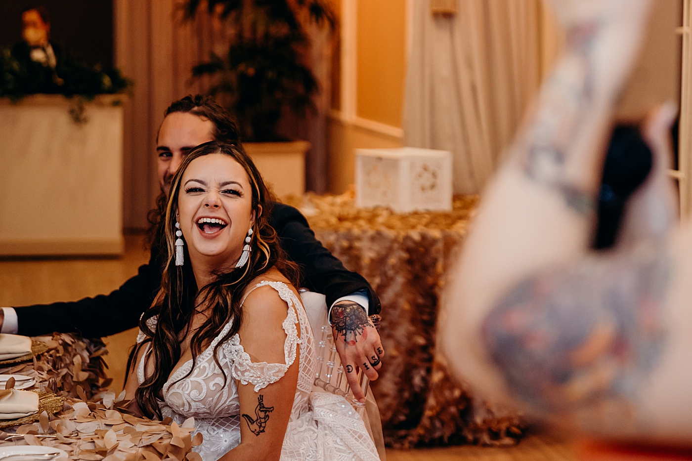 Bride laughing during Maid of Honor speech Benvenuto Restaurant Wedding Photography captured by South Florida Wedding Photographer Maggie Alvarez Photography
