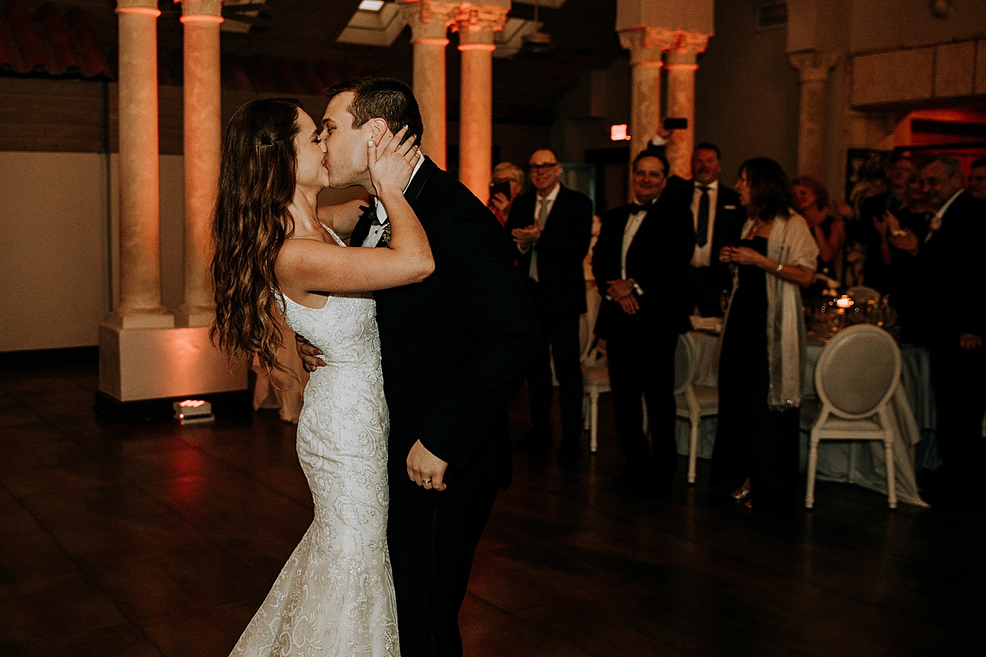 Bride and Groom kissing at Reception Coral Gables Country Club Wedding Photography captured by South Florida Wedding Photographer Maggie Alvarez Photography