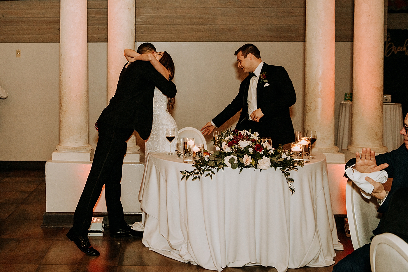 Bride hugging best man Coral Gables Country Club Wedding Photography captured by South Florida Wedding Photographer Maggie Alvarez Photography