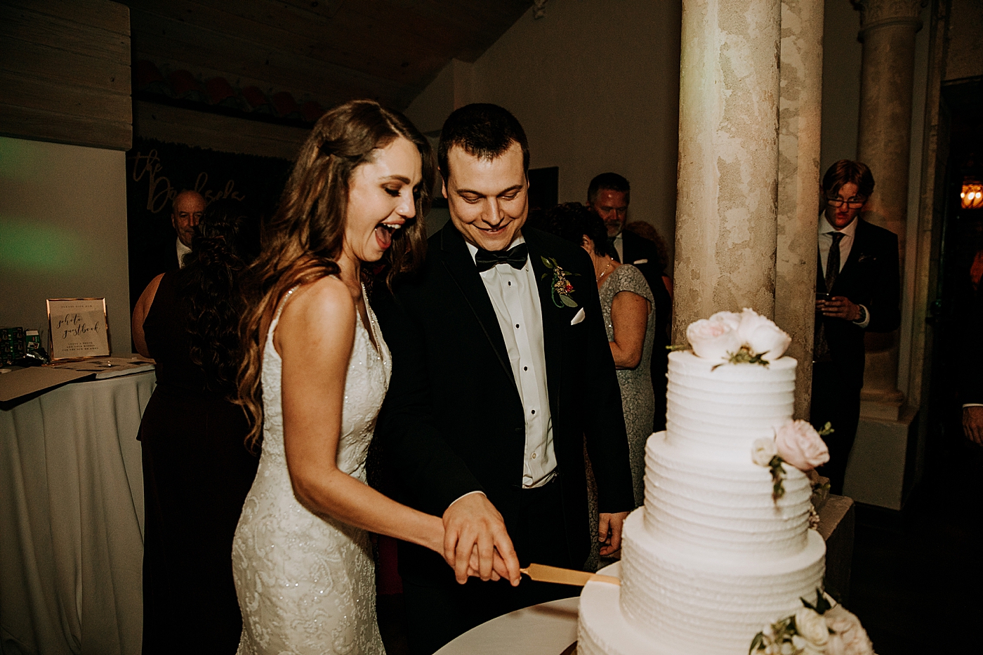Bride and Groom cutting cake together Coral Gables Country Club Wedding Photography captured by South Florida Wedding Photographer Maggie Alvarez Photography