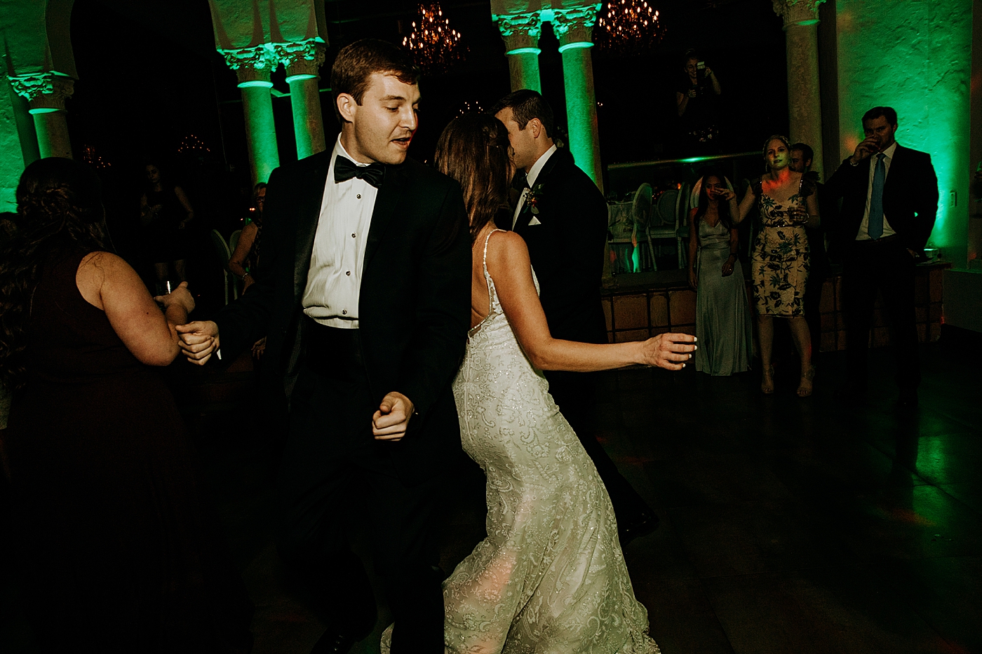 Candid dancing at Reception Coral Gables Country Club Wedding Photography captured by South Florida Wedding Photographer Maggie Alvarez Photography