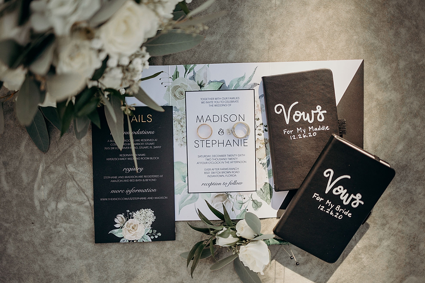 Wedding Detail shot of wedding bands invitations and vows with white bouquet Ever After Farms Wedding Photography captured by South Florida Wedding Photographer Maggie Alvarez Photography
