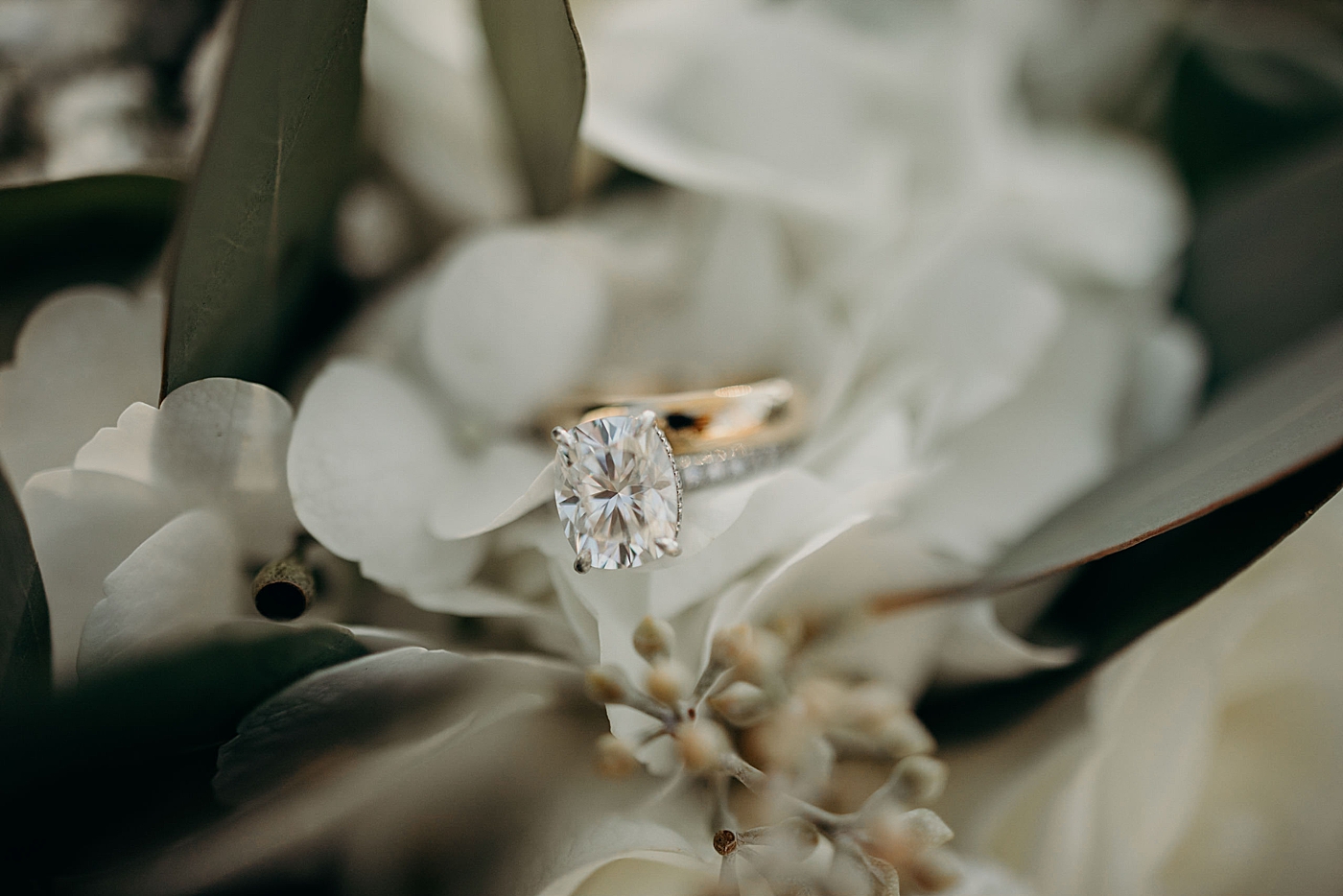 Wedding detail shot of diamond engagement ring in white bouquet Ever After Farms Wedding Photography captured by South Florida Wedding Photographer Maggie Alvarez Photography