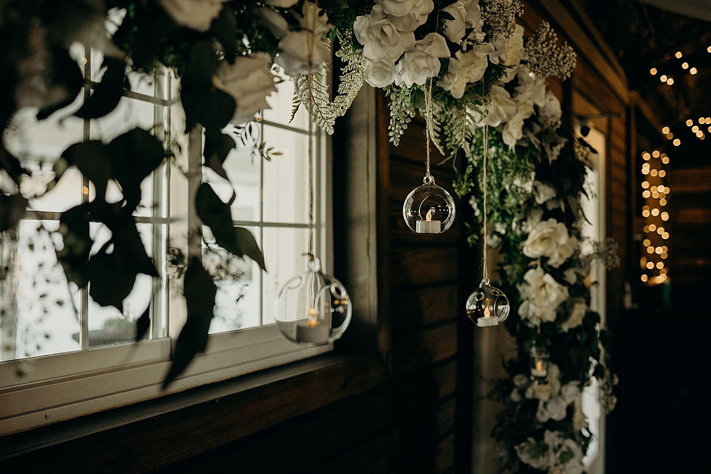 Reception detail shot of hanging lights with white floral draperiesEver After Farms Wedding Photography captured by South Florida Wedding Photographer Maggie Alvarez Photography 