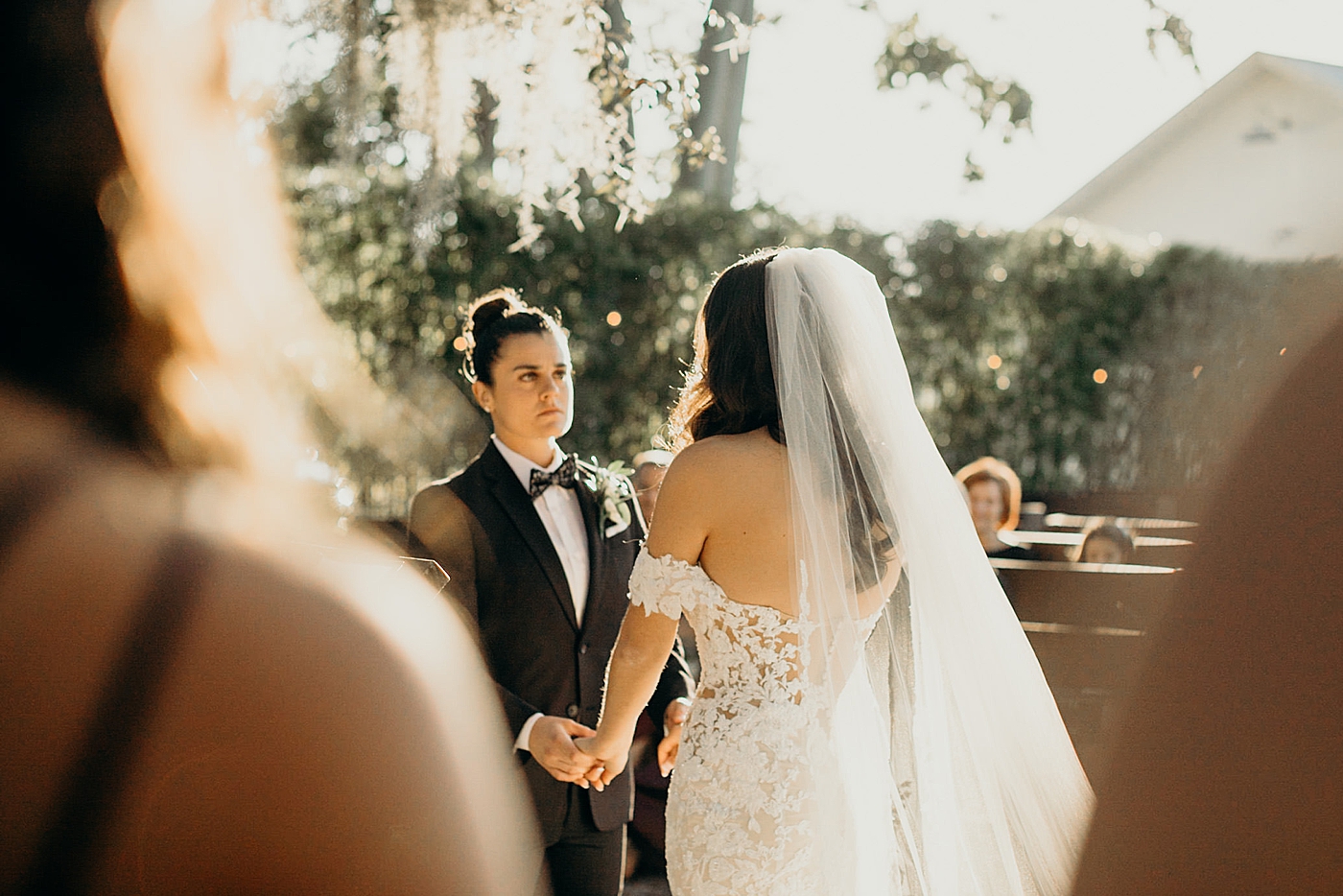 Brides holding hands ceremony Ever After Farms Wedding Photography captured by South Florida Wedding Photographer Maggie Alvarez Photography
