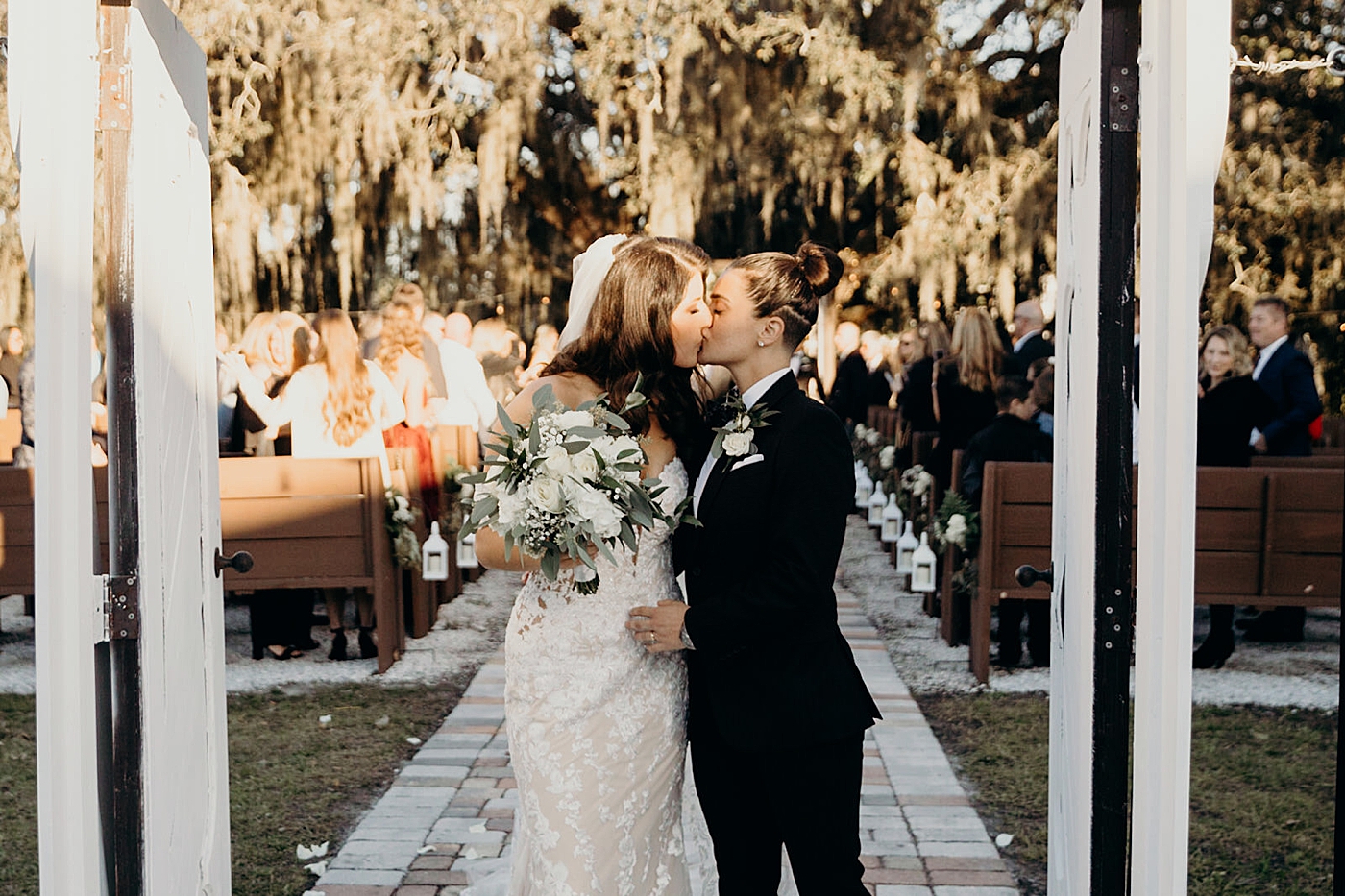 Couple kissing as they exit ceremony Ever After Farms Wedding Photography captured by South Florida Wedding Photographer Maggie Alvarez Photography