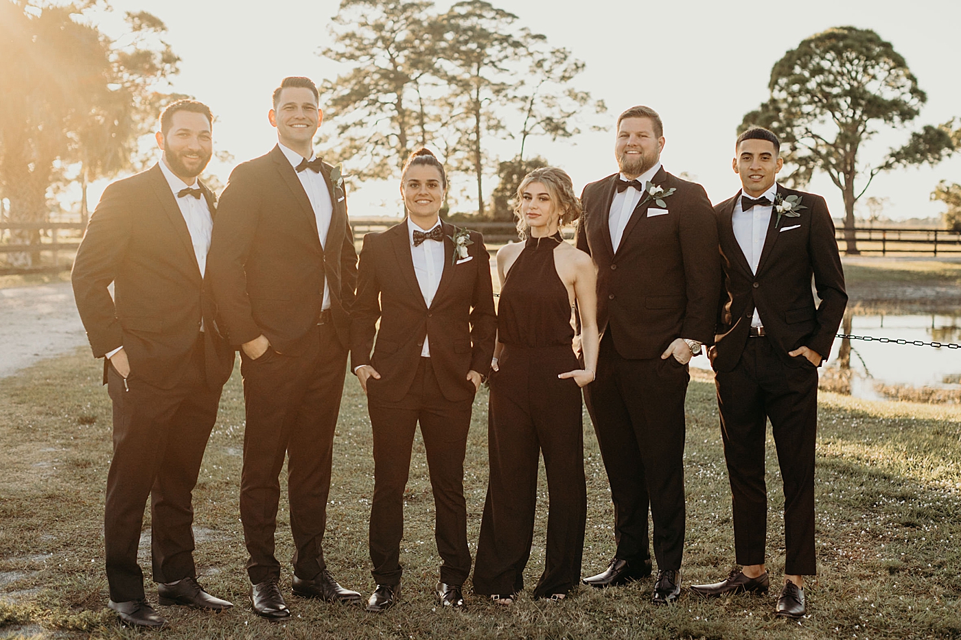Bride with wedding party portrait with sunset lighting Ever After Farms Wedding Photography captured by South Florida Wedding Photographer Maggie Alvarez Photography