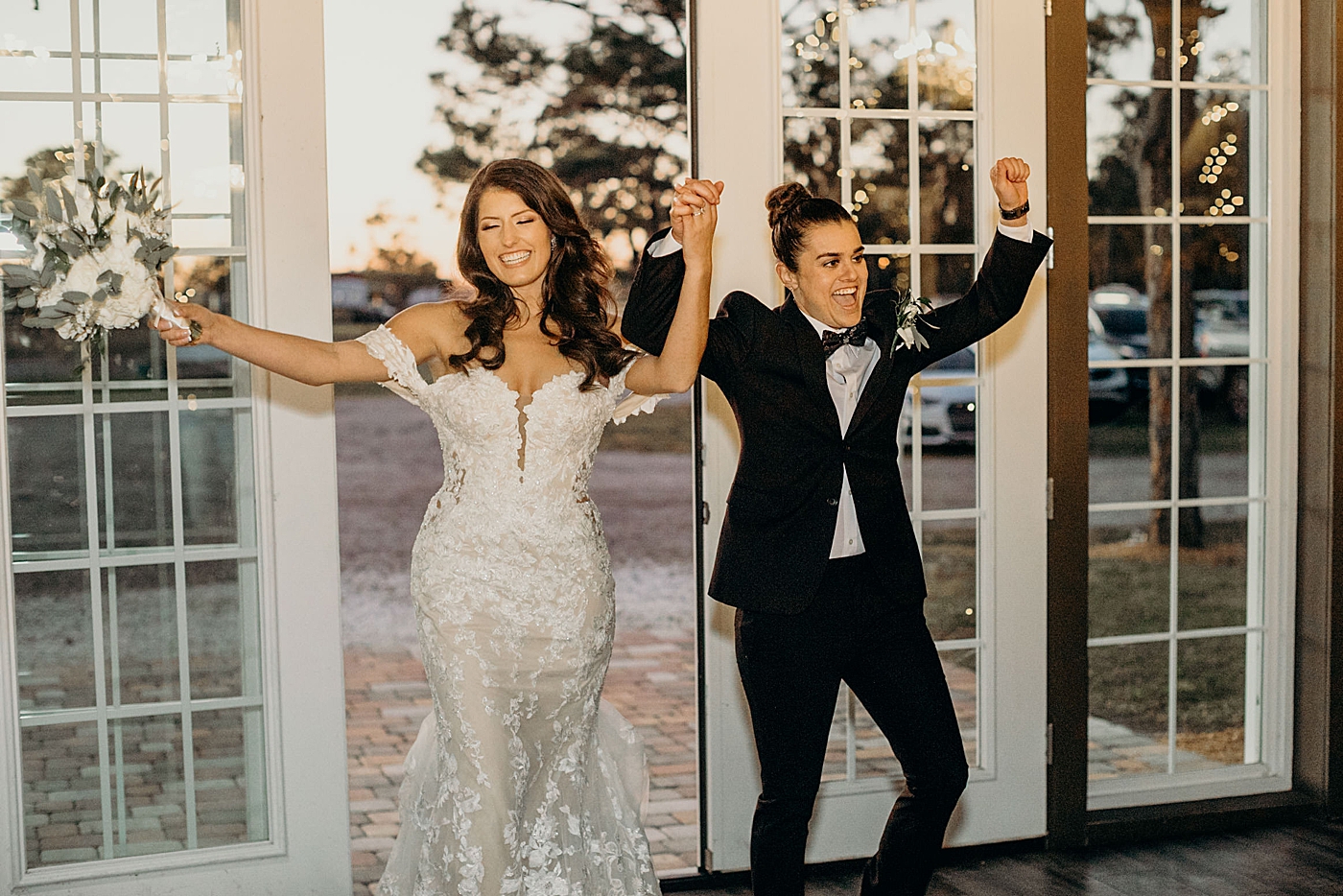 Couples excited entrance into Reception Ever After Farms Wedding Photography captured by South Florida Wedding Photographer Maggie Alvarez Photography