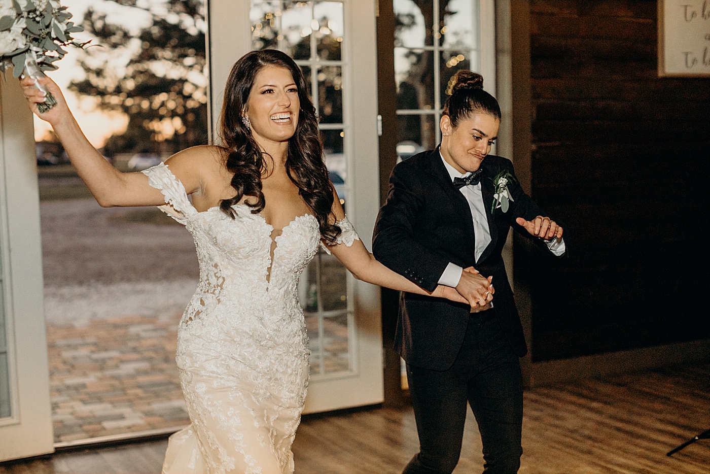 Couples excited entrance into Reception Ever After Farms Wedding Photography captured by South Florida Wedding Photographer Maggie Alvarez Photography