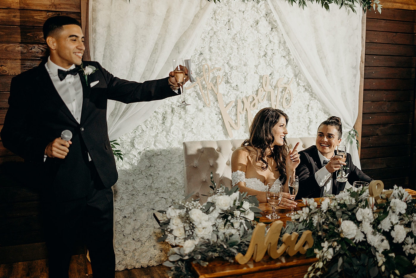 Wedding party speech cheers by sweetheart table Ever After Farms Wedding Photography captured by South Florida Wedding Photographer Maggie Alvarez Photography
