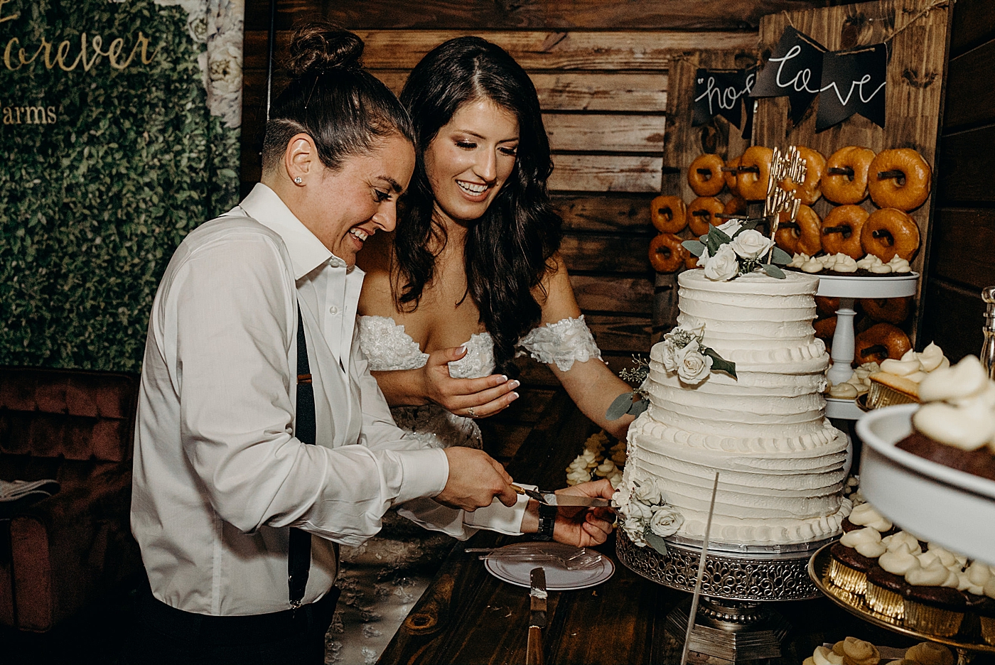 Couple cutting cake at reception Ever After Farms Wedding Photography captured by South Florida Wedding Photographer Maggie Alvarez Photography