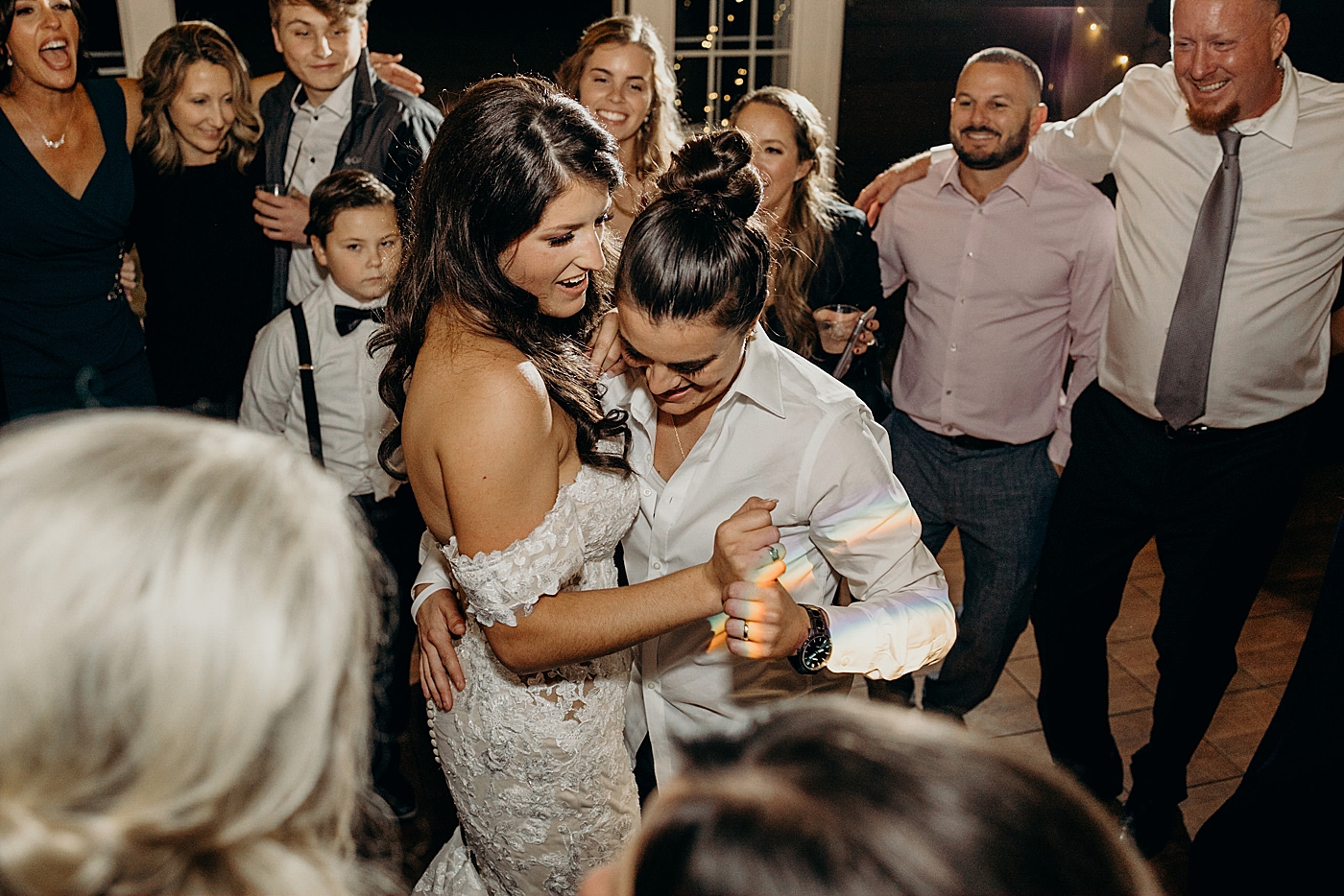 Brides in dance circle reception Ever After Farms Wedding Photography captured by South Florida Wedding Photographer Maggie Alvarez Photography