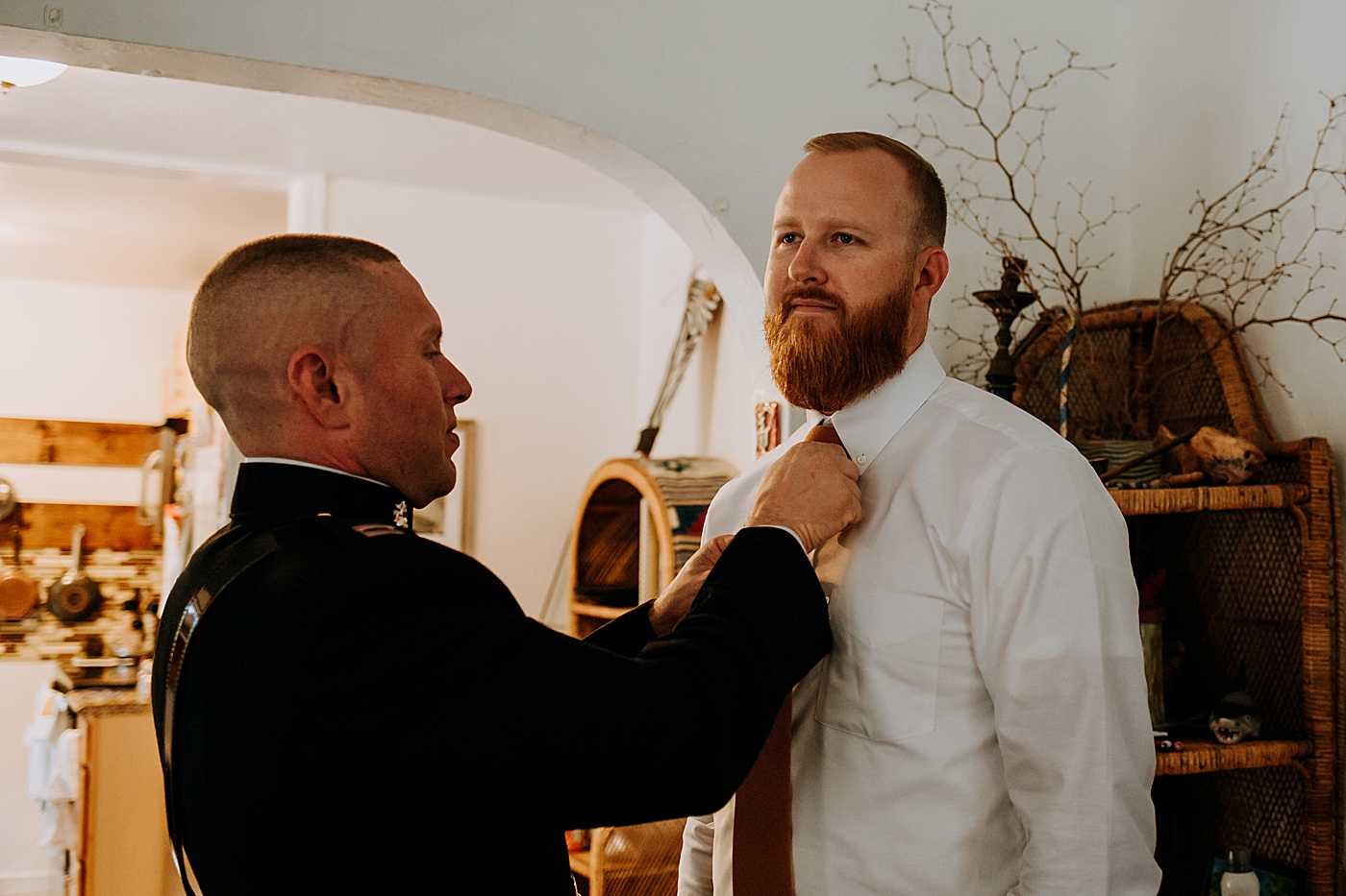Best man adjusting Groom's tie Historic Stranahan House Wedding Photography captured by South Florida Wedding Photographer Maggie Alvarez Photography