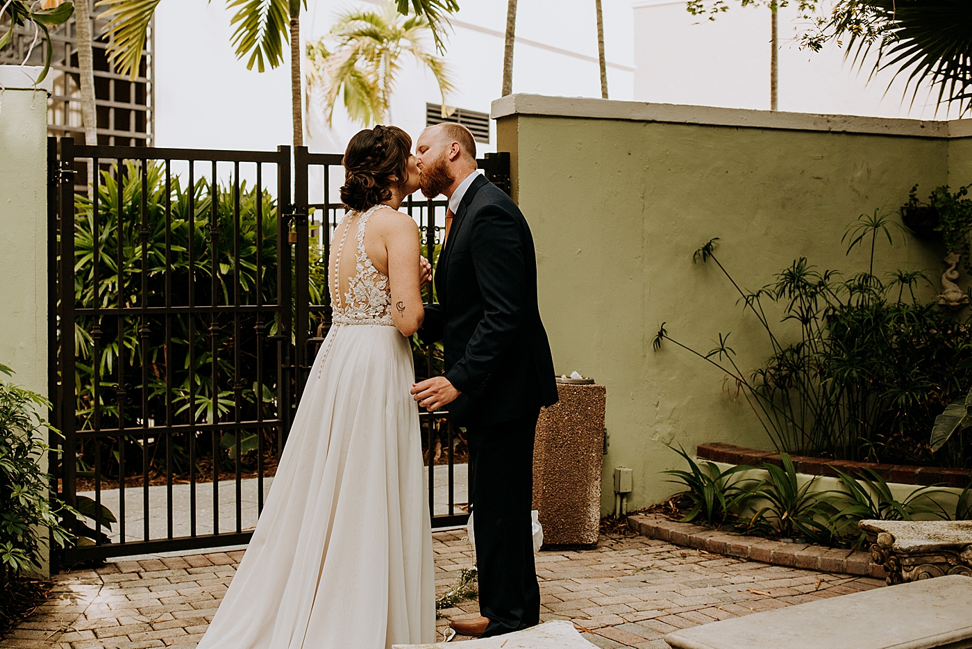 Bride and Groom kissing after First Look Historic Stranahan House Wedding Photography captured by South Florida Wedding Photographer Maggie Alvarez Photography