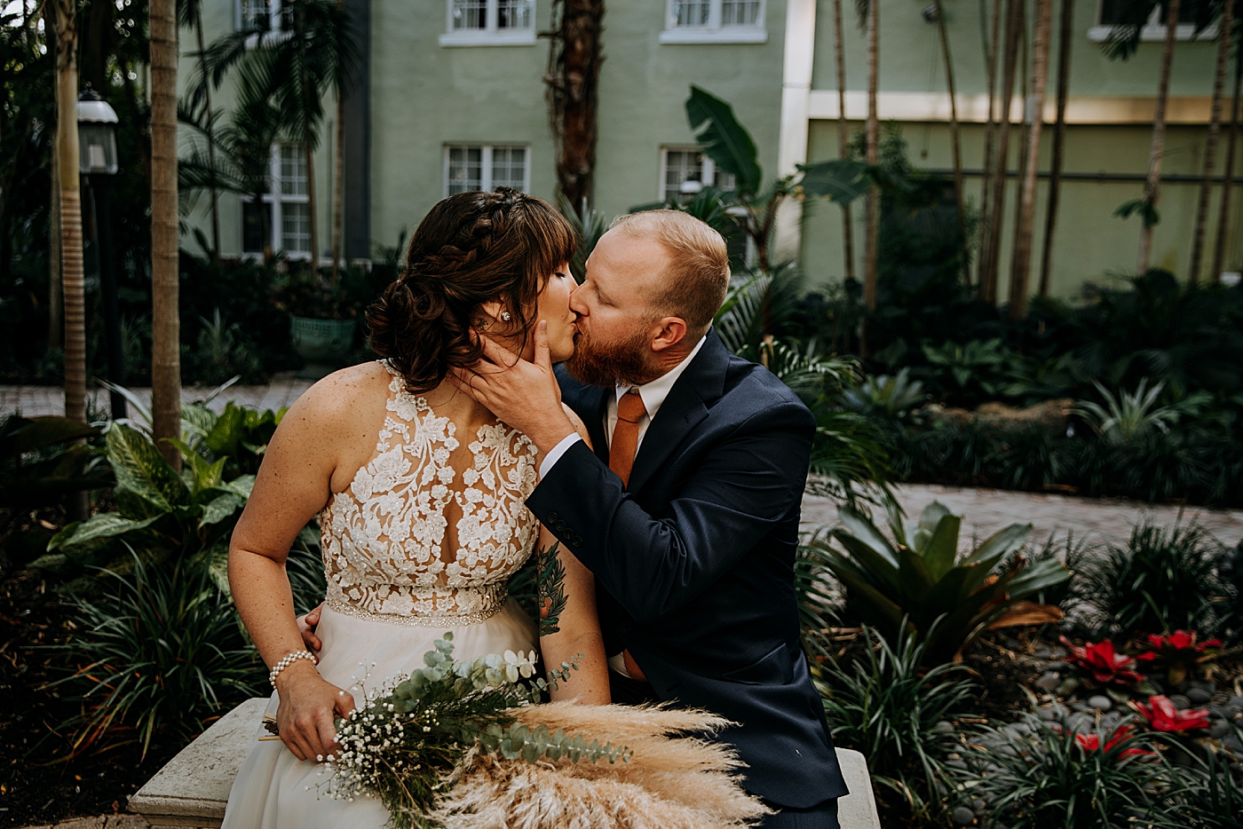 Bride and Groom sitting and kissing each other Historic Stranahan House Wedding Photography captured by South Florida Wedding Photographer Maggie Alvarez Photography