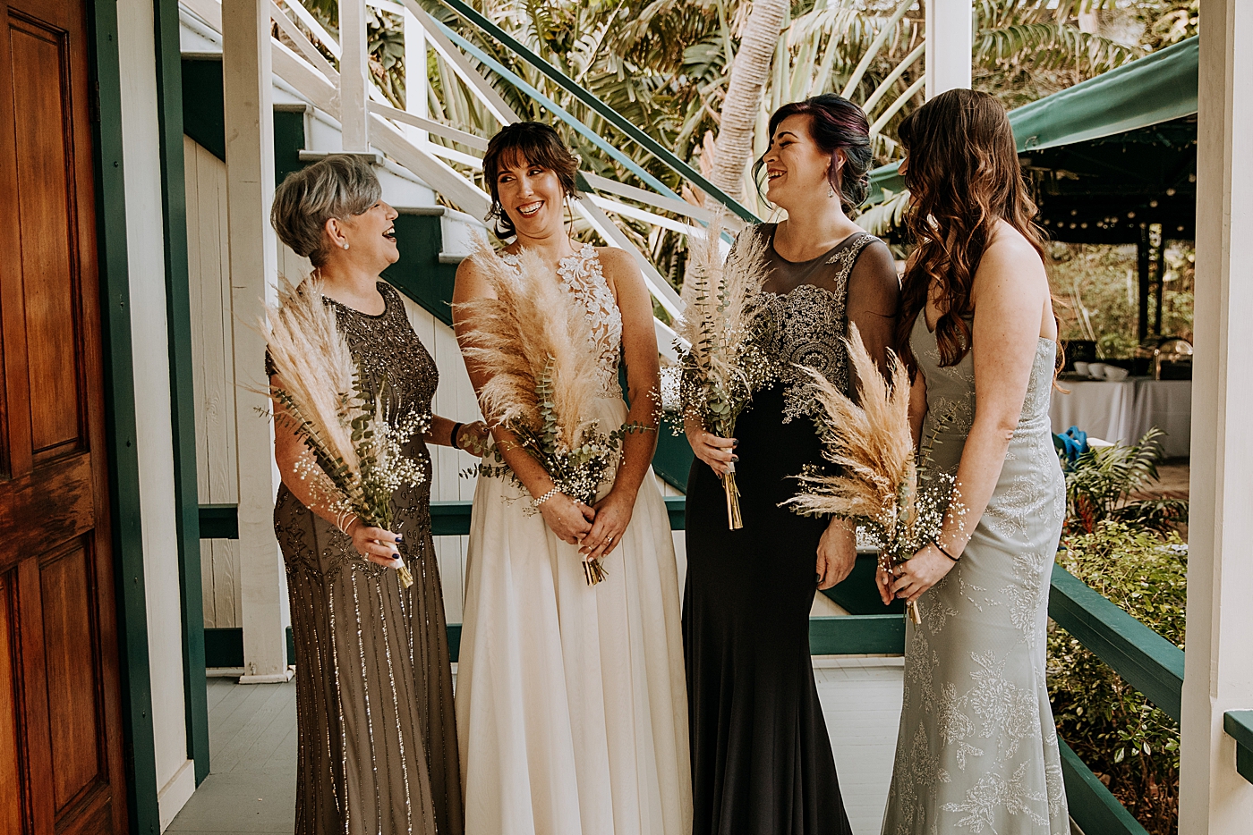 Bride with family and Bridesmaids Historic Stranahan House Wedding Photography captured by South Florida Wedding Photographer Maggie Alvarez Photography