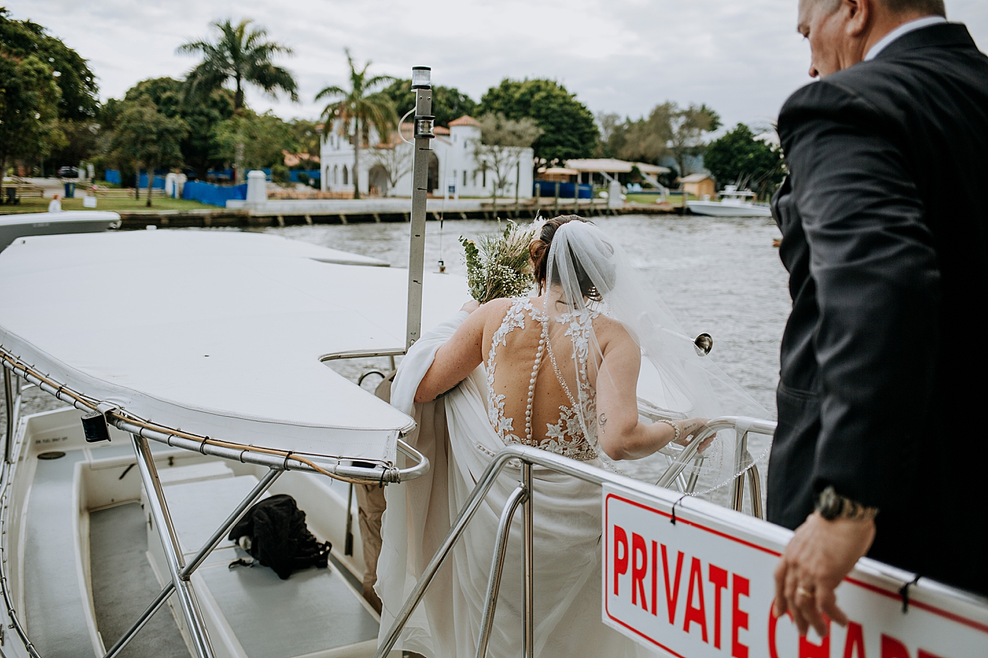 Bride and Father getting on boat Historic Stranahan House Wedding Photography captured by South Florida Wedding Photographer Maggie Alvarez Photography