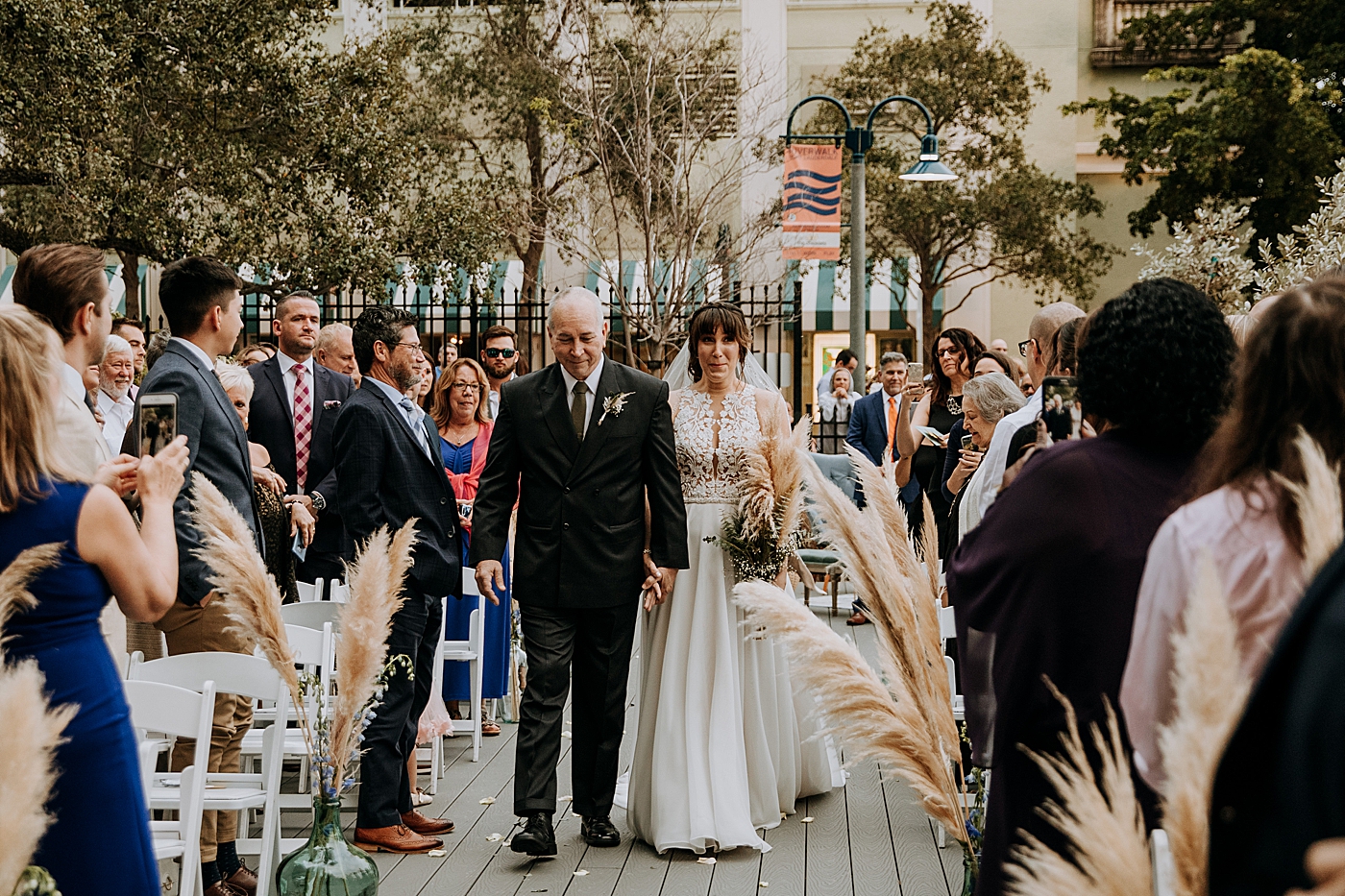 Father and daughter going down aisle Historic Stranahan House Wedding Photography captured by South Florida Wedding Photographer Maggie Alvarez Photography