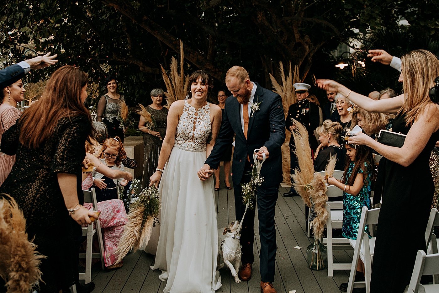 Bride and Groom leaving Ceremony with dog Historic Stranahan House Wedding Photography captured by South Florida Wedding Photographer Maggie Alvarez Photography