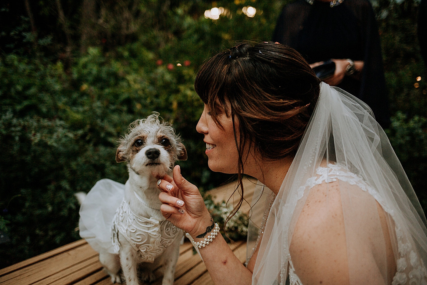 Bride looking at her Dog Historic Stranahan House Wedding Photography captured by South Florida Wedding Photographer Maggie Alvarez Photography