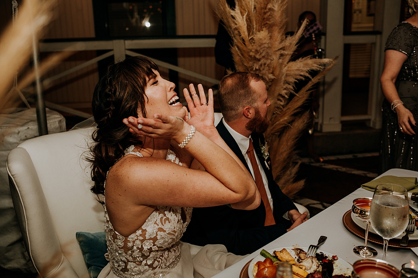 Candid shot of Bride and Groom during speeches Historic Stranahan House Wedding Photography captured by South Florida Wedding Photographer Maggie Alvarez Photography