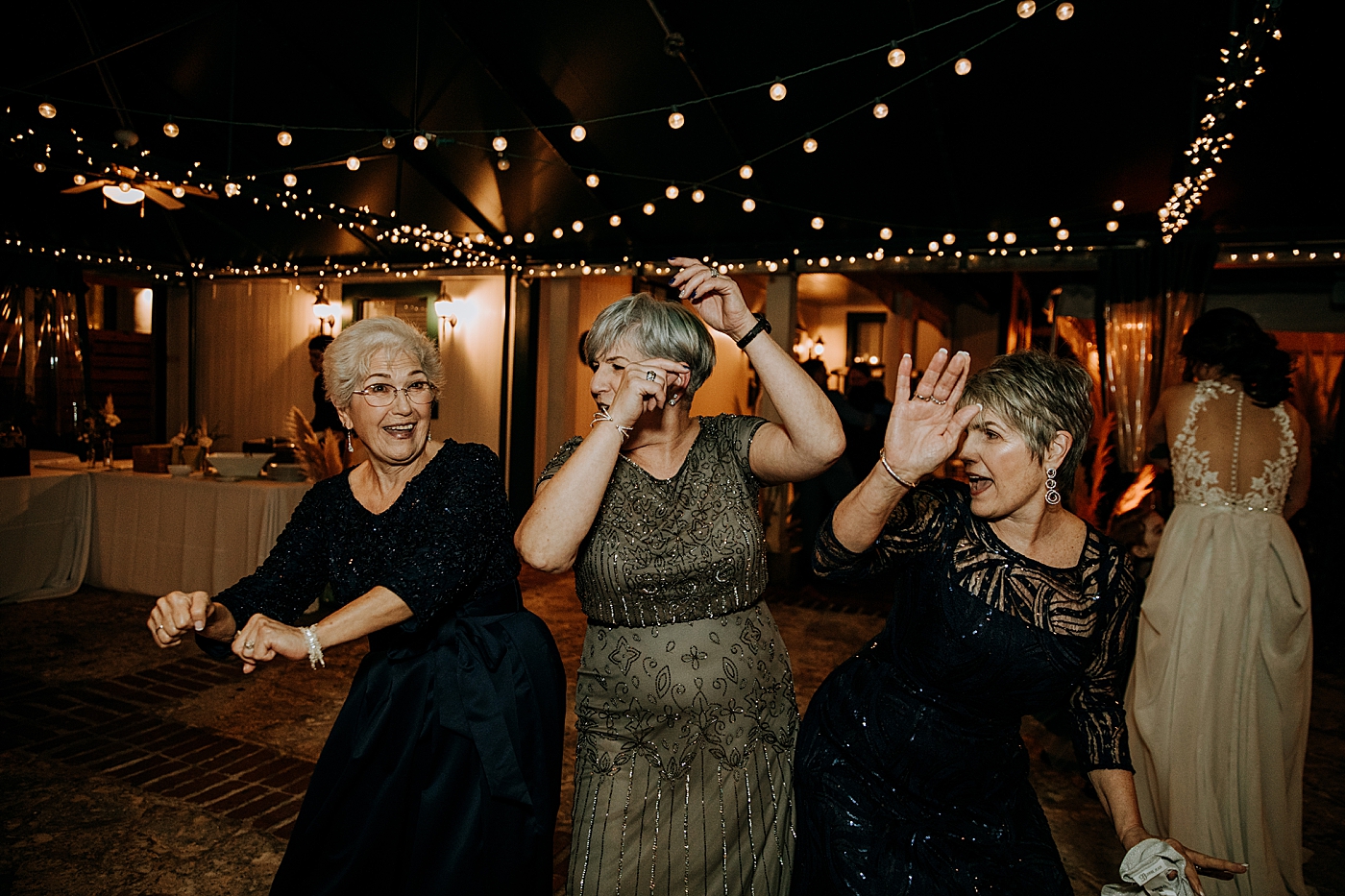 Candid dancing reception Historic Stranahan House Wedding Photography captured by South Florida Wedding Photographer Maggie Alvarez Photography