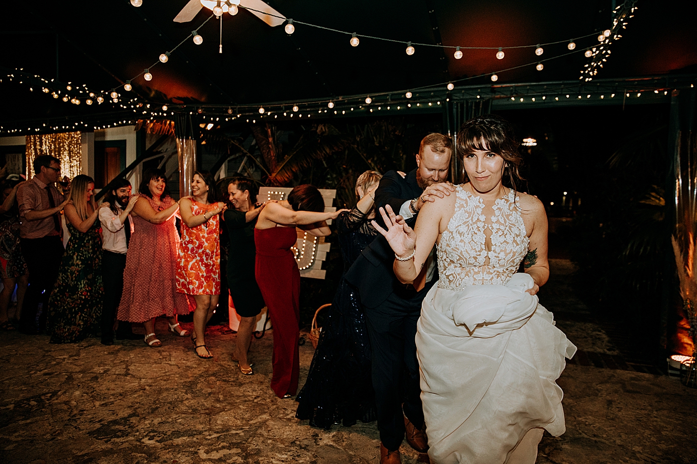 Conga line at Reception Historic Stranahan House Wedding Photography captured by South Florida Wedding Photographer Maggie Alvarez Photography