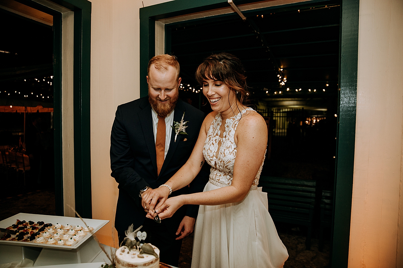 Cake cutting Historic Stranahan House Wedding Photography captured by South Florida Wedding Photographer Maggie Alvarez Photography