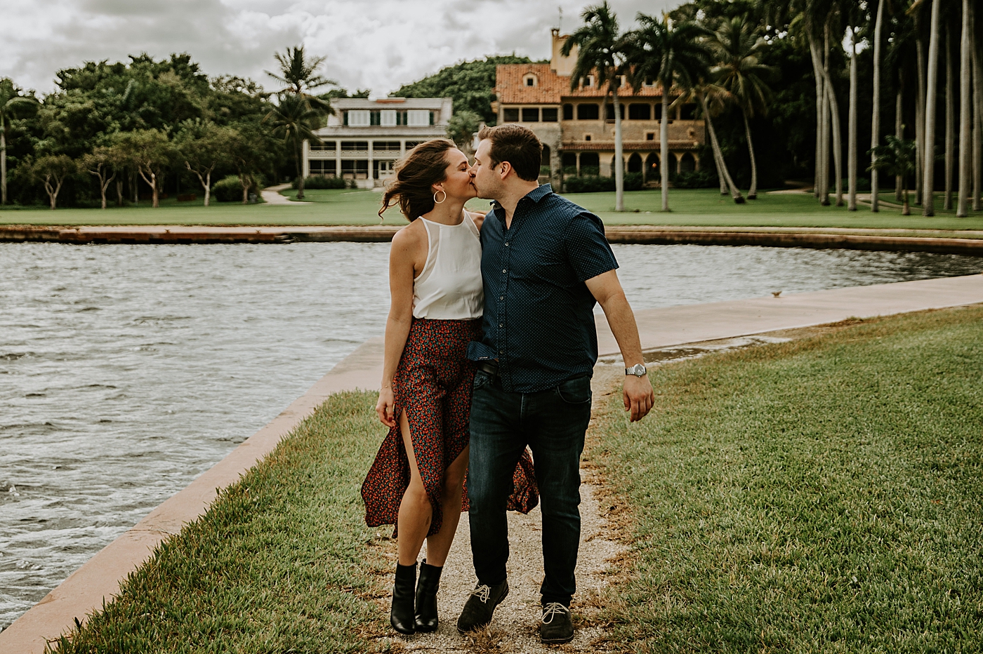 Couple kissing each other by the water Deering Estate Engagement Photography captured by Maggie Alvarez Photography