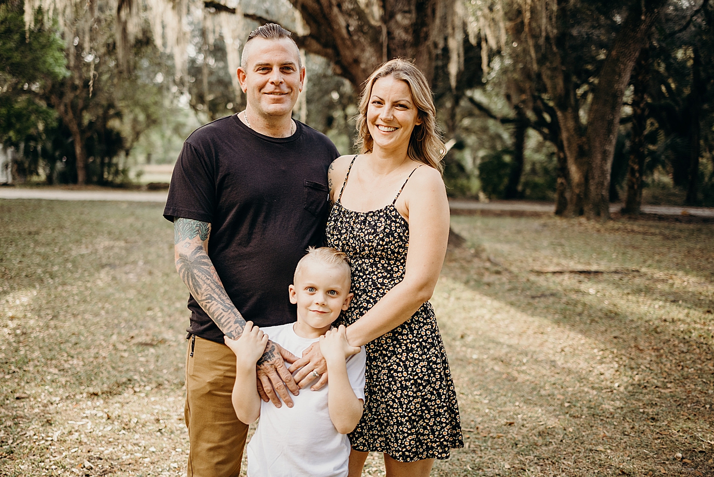 Mom and Dad wrapping their hands on child out in the forest Riverbend Park Family Photography by South Florida Family Photographer Maggie Alvarez Photography