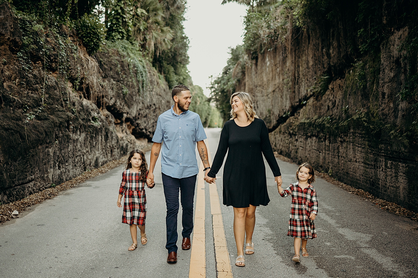 Family holding hands walking down road Palm Beach Island Family Photography by South Florida Family Photographer Maggie Alvarez Photography