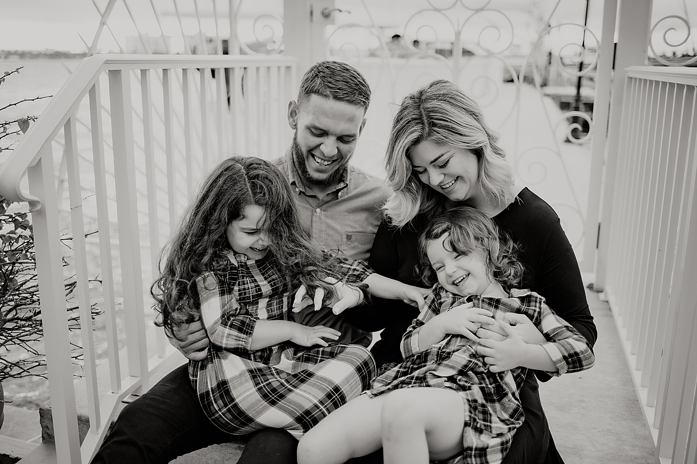 B&W Parents holding kids on lap Palm Beach Island Family Photography by South Florida Family Photographer Maggie Alvarez Photography