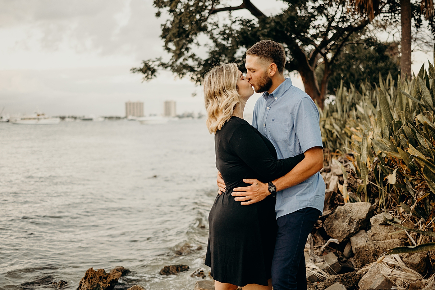 Couple kissing by the water on the beach Palm Beach Island Family Photography by South Florida Family Photographer Maggie Alvarez Photography