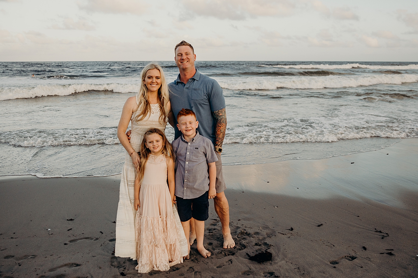 Family standing together on the beach shoreline Ocean Ridge Hammock Park Family Photography by South Florida Family Photographer Maggie Alvarez Photography