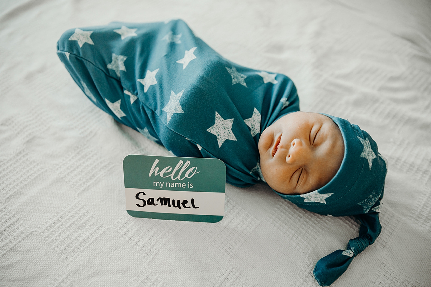 Baby in star swaddle with name tag South Florida Fresh 48 Newborn Photography by South Florida Family Photographer Maggie Alvarez Photography 