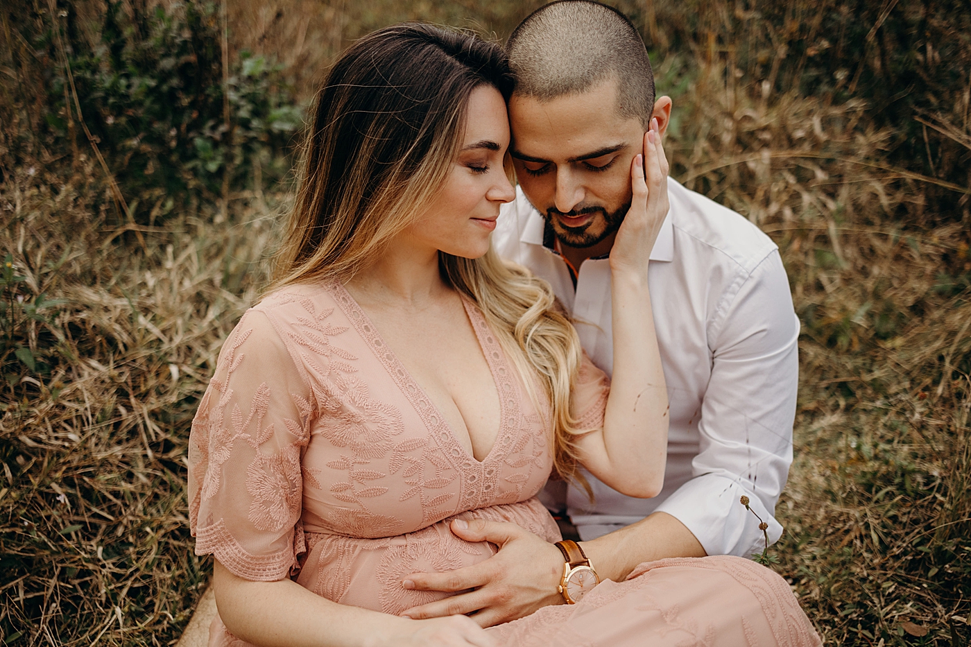 Couple sitting together and holding each other Riverbend Park Maternity Photography by South Florida Family Photographer Maggie Alvarez Photography