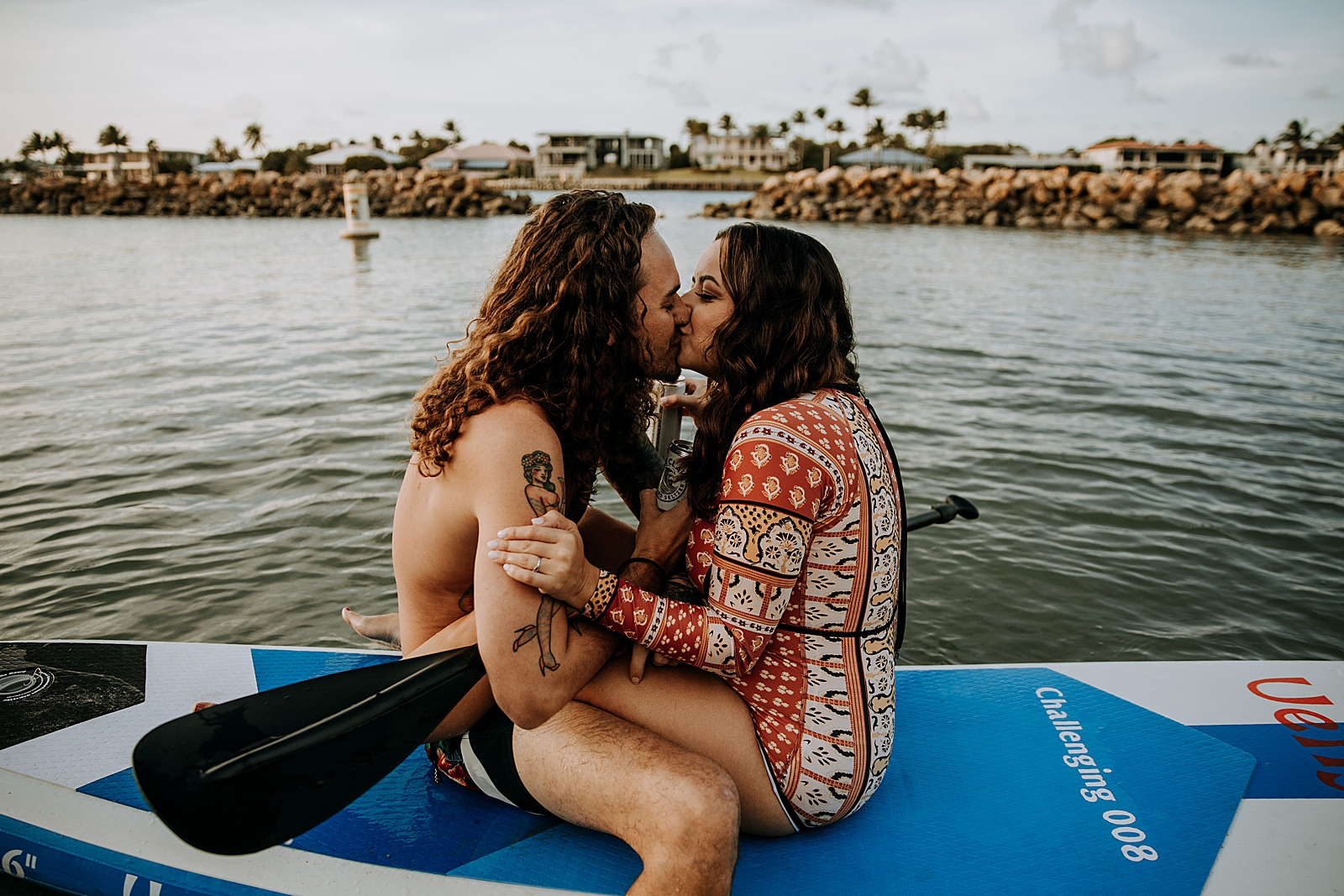 Couple kissing on canoe in the water Dubois Park Engagement Photography captured by South Florida Family Photographer Maggie Alvarez Photography