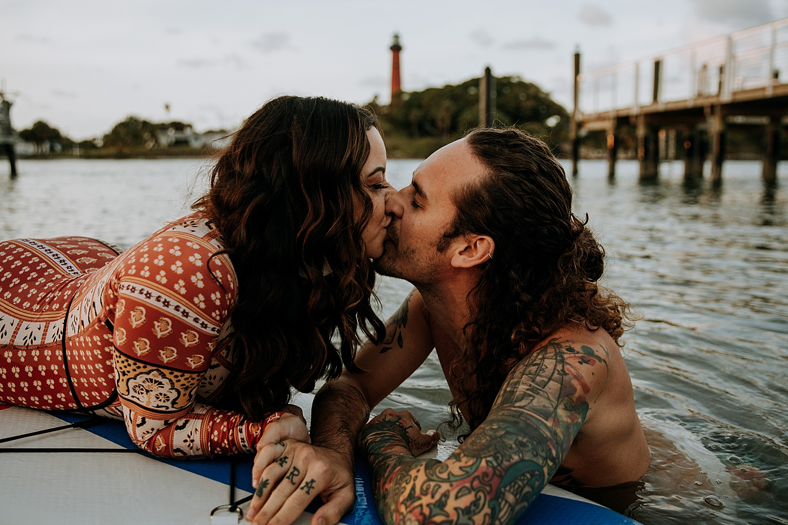 Couple kissing on the water Dubois Park Engagement Photography captured by South Florida Family Photographer Maggie Alvarez Photography