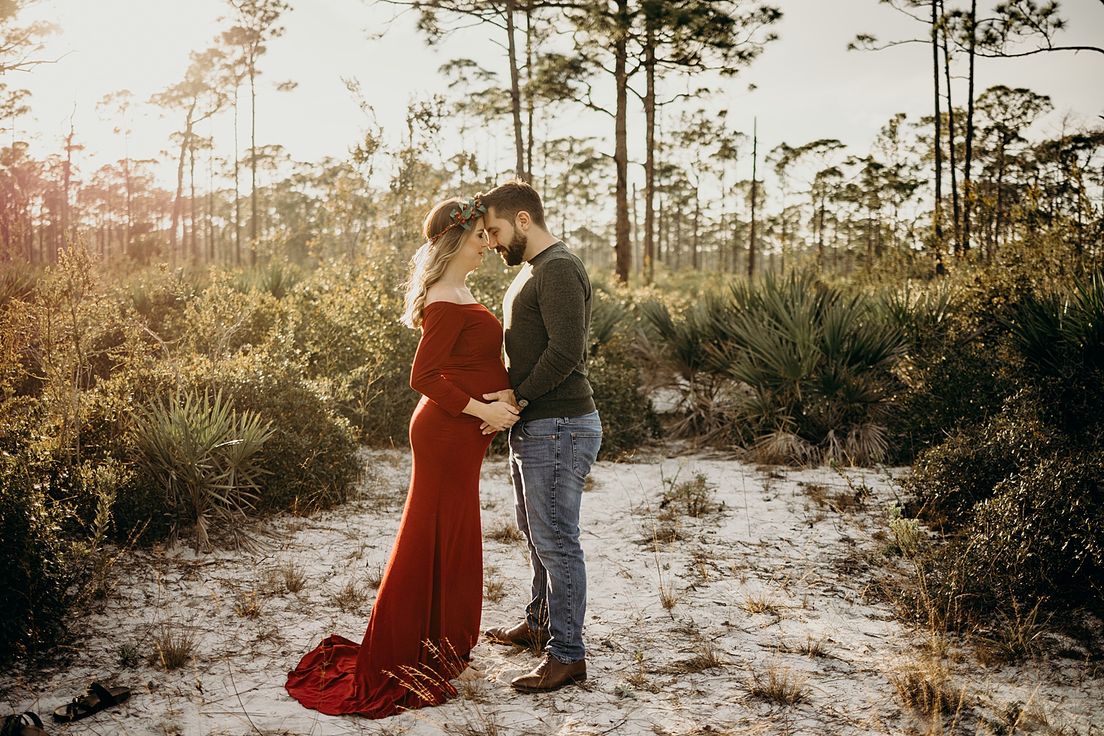 Couple resting their heads against each other Johnathan Dickinson Park Maternity Photography captured by South Florida Family Photographer Maggie Alvarez Photography