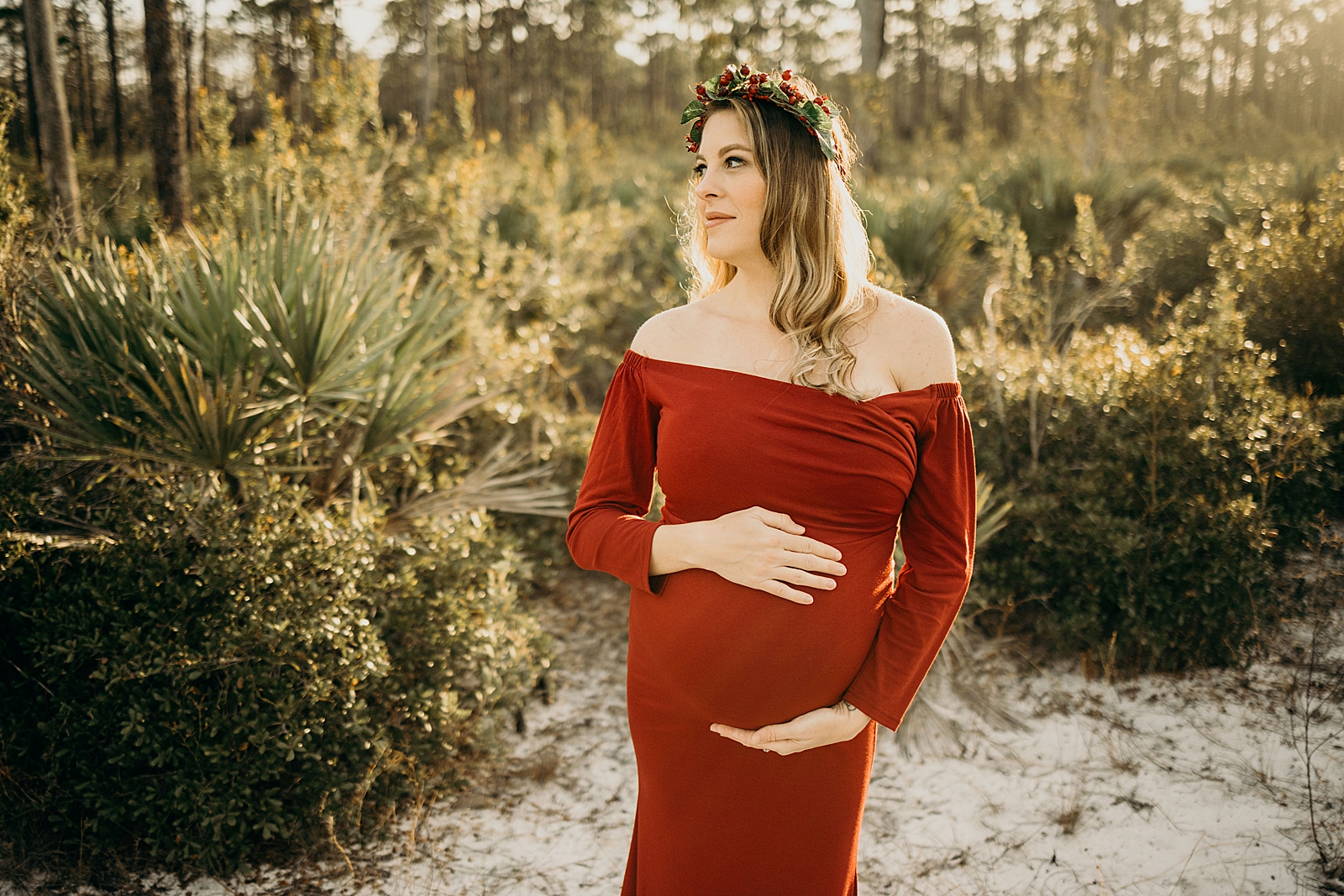 Pregnant lady posing holding pregnant stomach Johnathan Dickinson Park Maternity Photography captured by South Florida Family Photographer Maggie Alvarez Photography