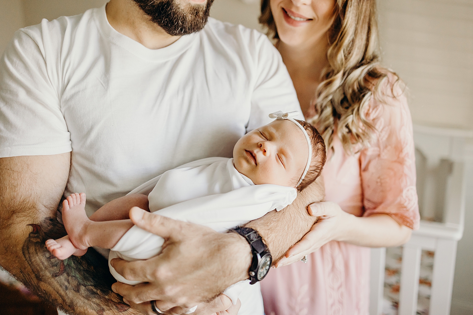 Parents holding sleeping toddler South Florida Newborn Photography Photography captured by South Florida Family Photographer Maggie Alvarez Photography