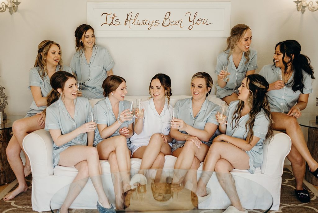 Bride and Bridesmaids before Getting ready having a glass of Champaign