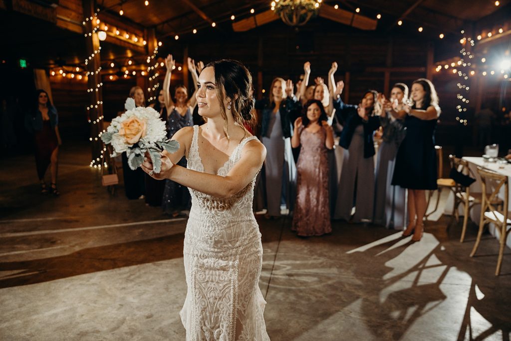 Bride about to throw bouquet for bouquet toss