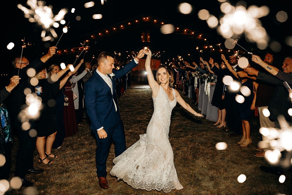 Bride and Groom twirling during sparkler exit
