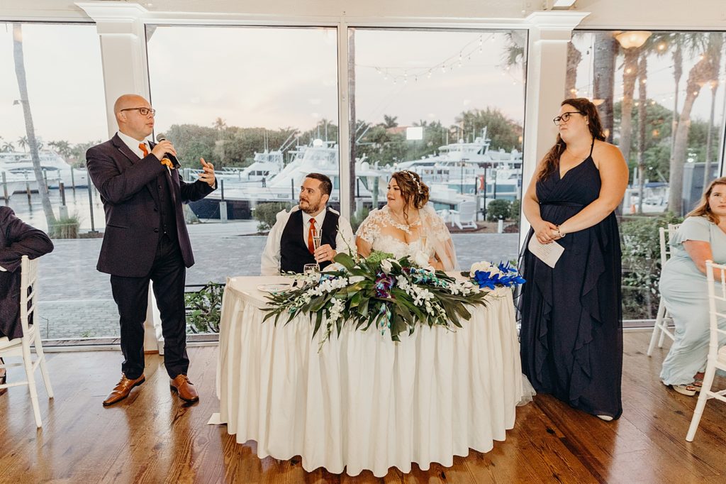 Best man toast by sweetheart table with Bride and Groom